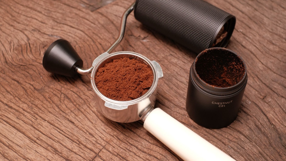 A macro view showing the uniform texture and consistent particle size of freshly ground coffee.