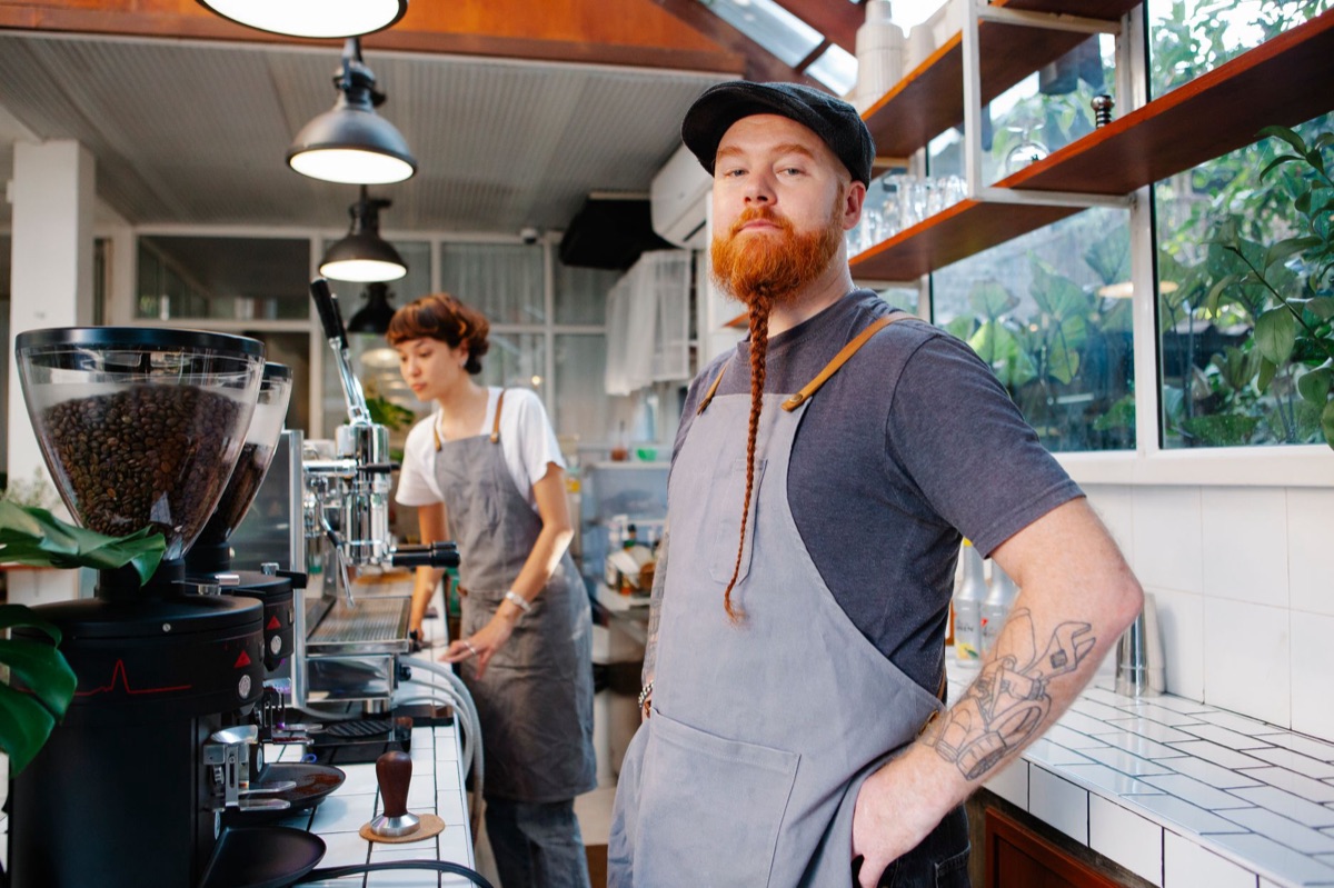 barista in traditional uniform