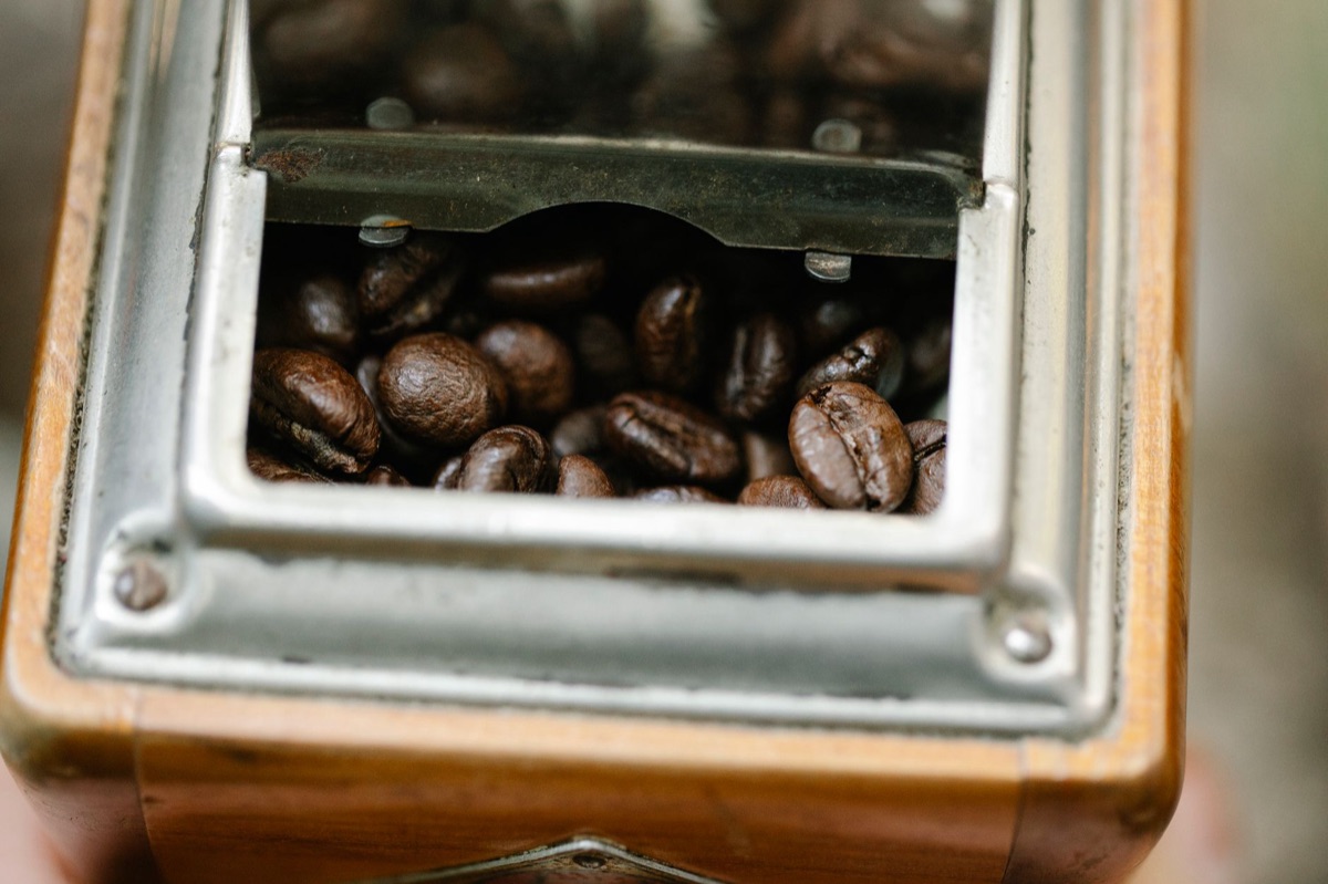 coffee grinder close up with beans