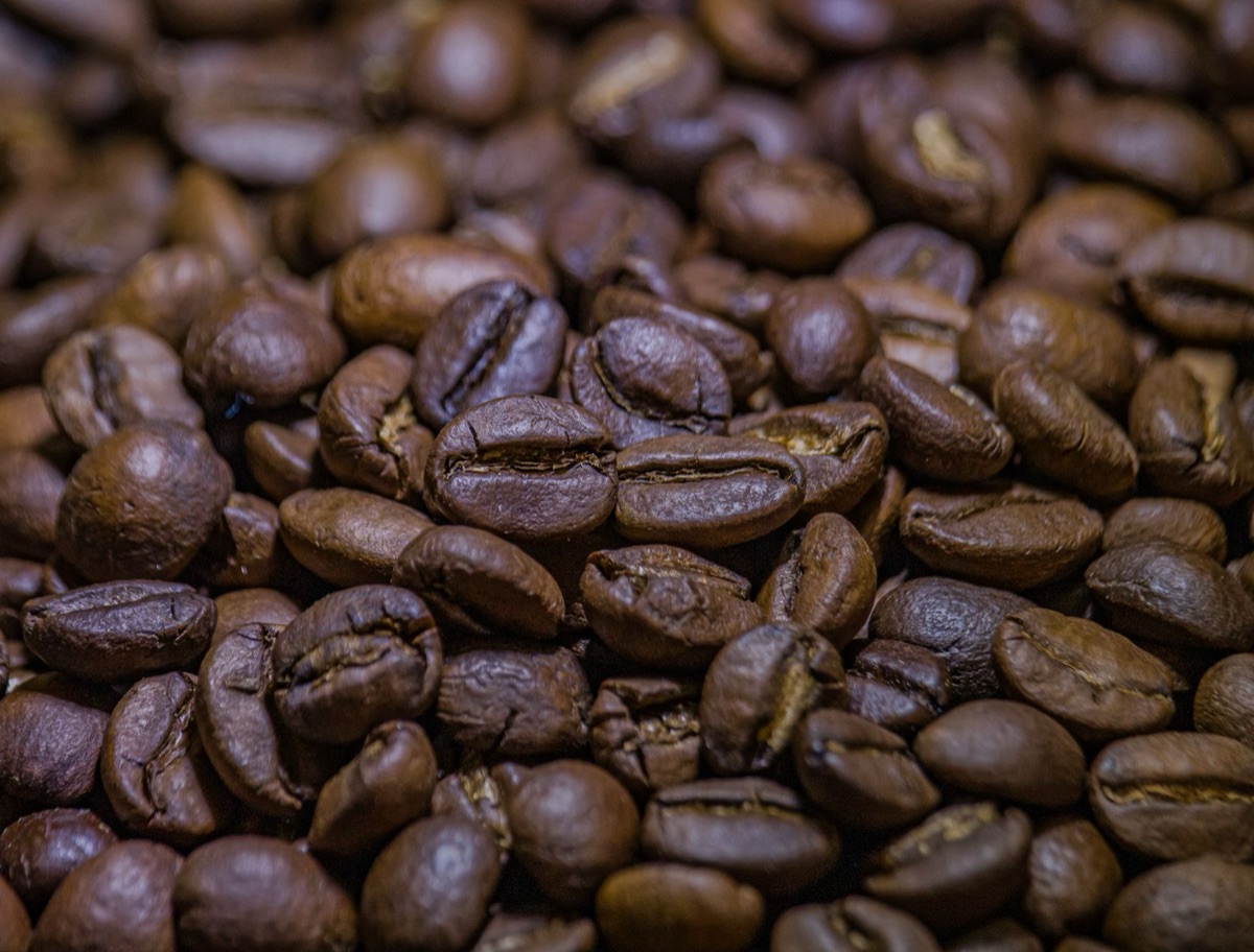 Purified coffee bean with a dark, uneven surface